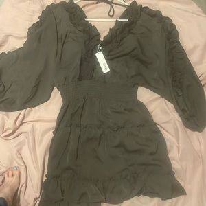 Glam dress with 3/4 length sleeves with built in shorts. NWT size small